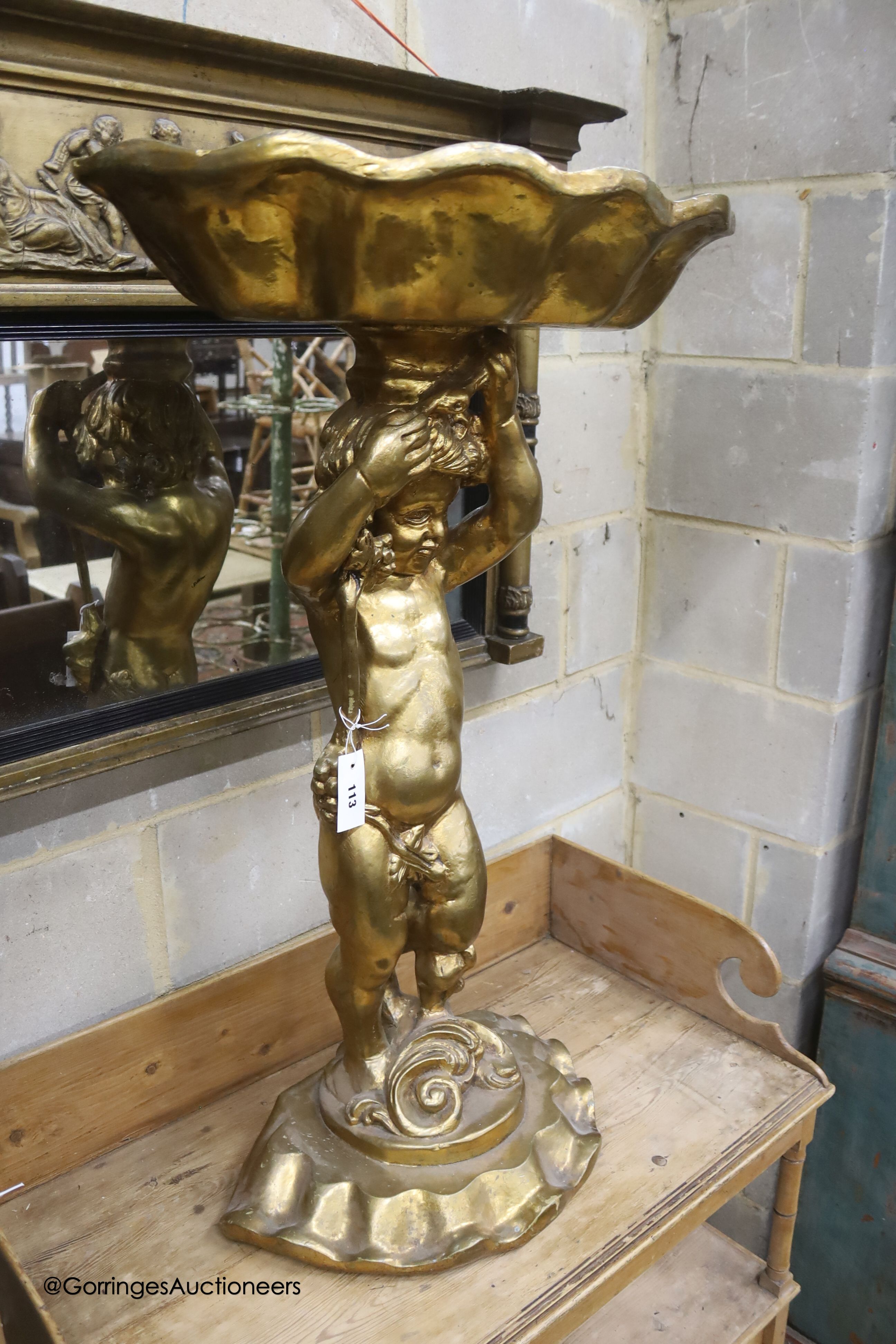 A gilt composition cherub and shell table, height 98cm